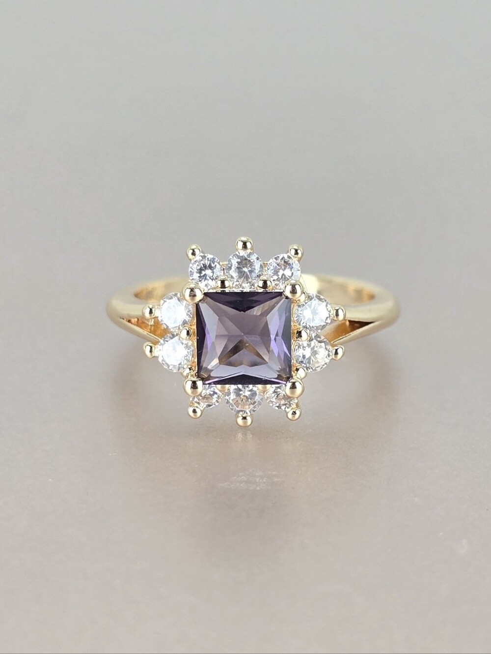 Gold Ring with Purple Center Stone and Halo Accent